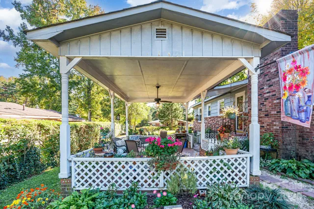 a couple of people sitting in front of a glass door