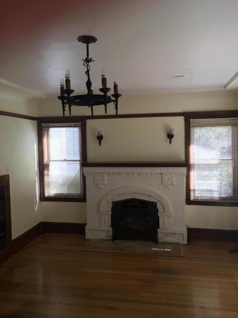 10 Bancroft Road Burlingame, CA 94010 - Photo 4 of 11 a living room with a fireplace and a flat screen tv