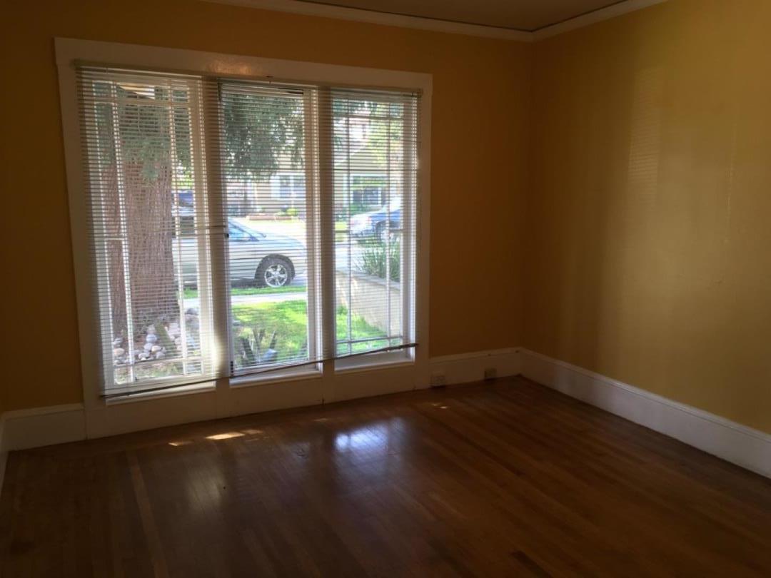 10 Bancroft Road Burlingame, CA 94010 - Photo 5 of 11 a view of an empty room with wooden floor and a window