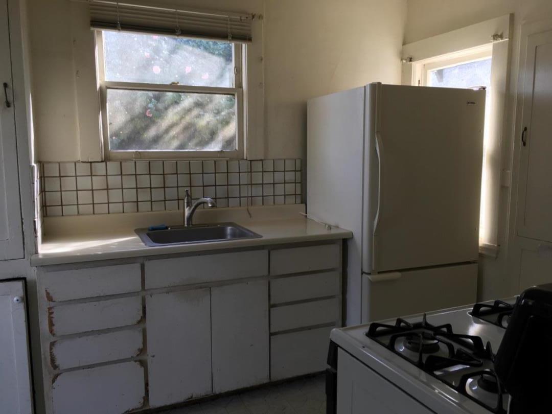 10 Bancroft Road Burlingame, CA 94010 - Photo 7 of 11 a kitchen with a sink and a refrigerator