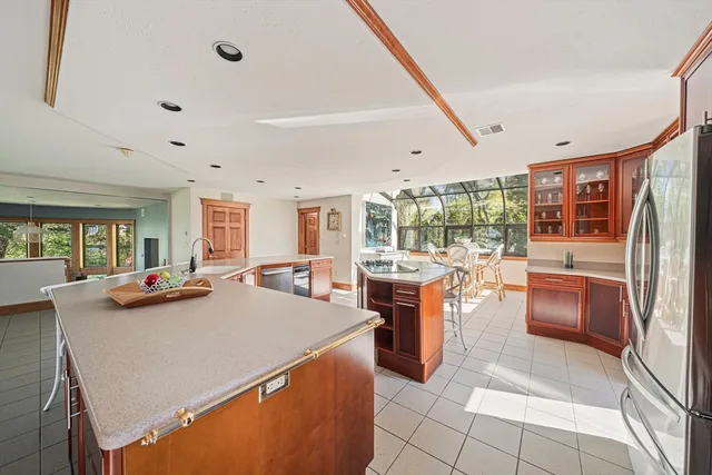 a dining room with furniture water view and balcony