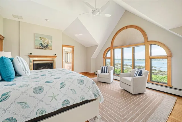 a bathroom with a granite countertop sink mirror vanity and a toilet