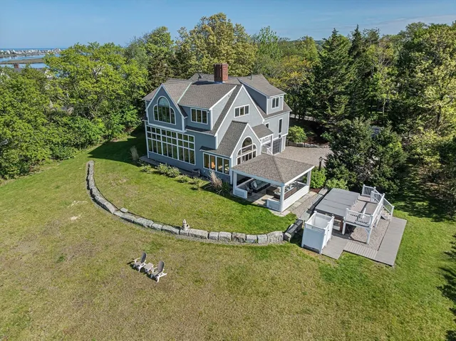 a front view of a house with a yard and a garage