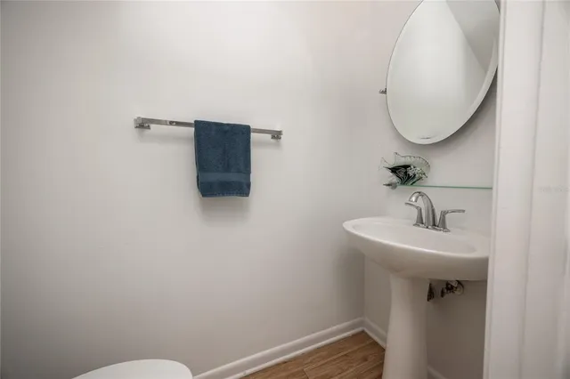 a bathroom with a sink and mirror