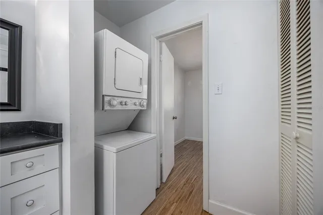 a en suite bathroom with a granite countertop sink and a toilet