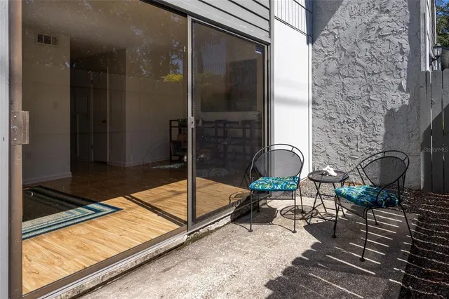 a backyard of a house with lots of green space and trees