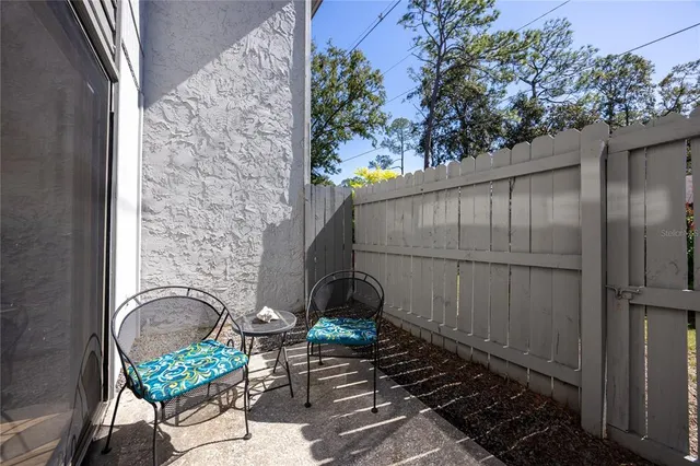 a view of balcony with furniture