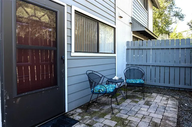 a view of two chairs in the balcony