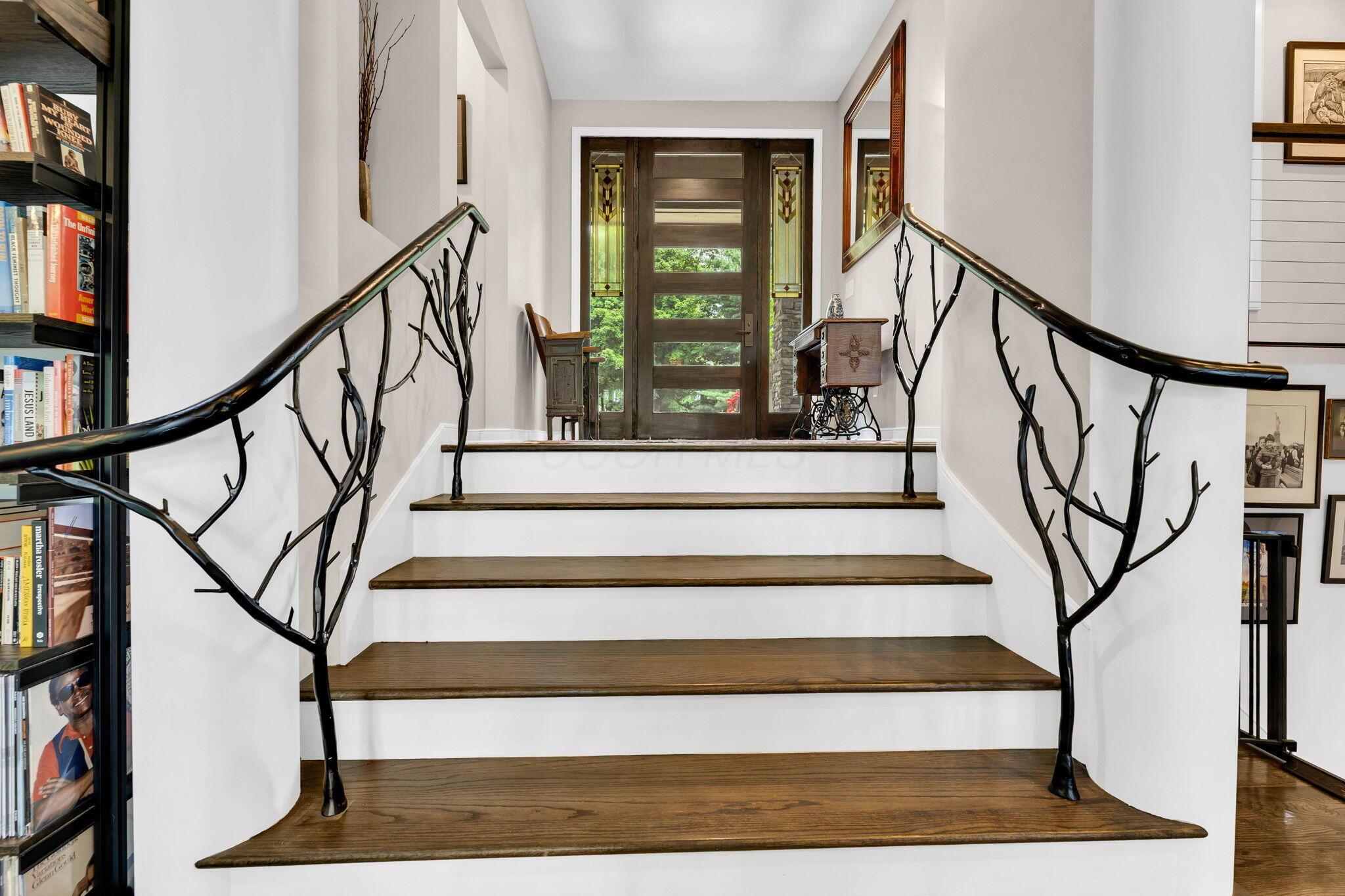 4972 Red Bank Road Galena, OH 43021 - Photo 5 of 123 Custom wrought iron staircase railing with a tree branch motif.