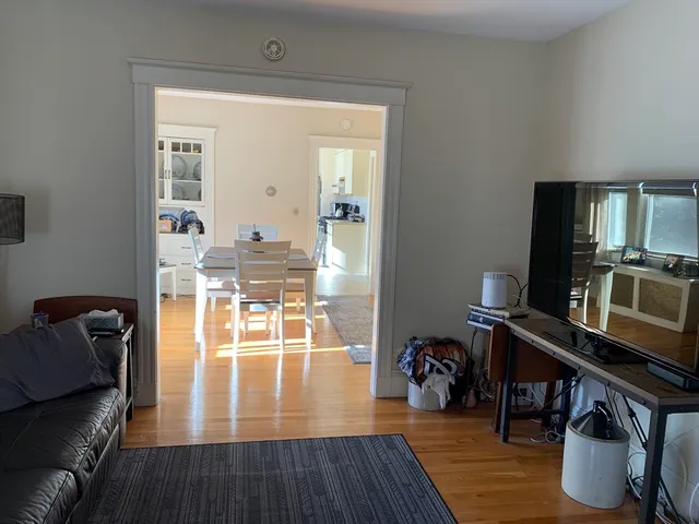 a view of a living room and dining room