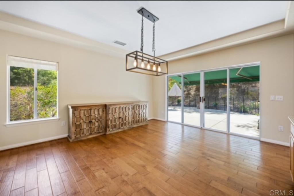 4009 Pala Mesa Oaks Drive Fallbrook, CA 92028 - Photo 11 of 45 a view of a room with wooden floor staircase and windows