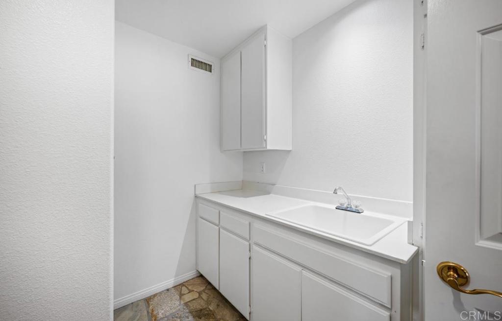 4009 Pala Mesa Oaks Drive Fallbrook, CA 92028 - Photo 17 of 45 a bathroom with a sink and a vanity