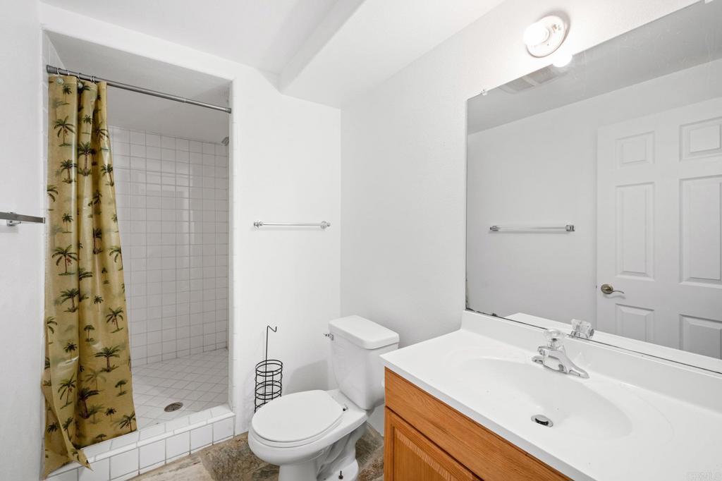 4009 Pala Mesa Oaks Drive Fallbrook, CA 92028 - Photo 25 of 45 a bathroom with a sink toilet and shower