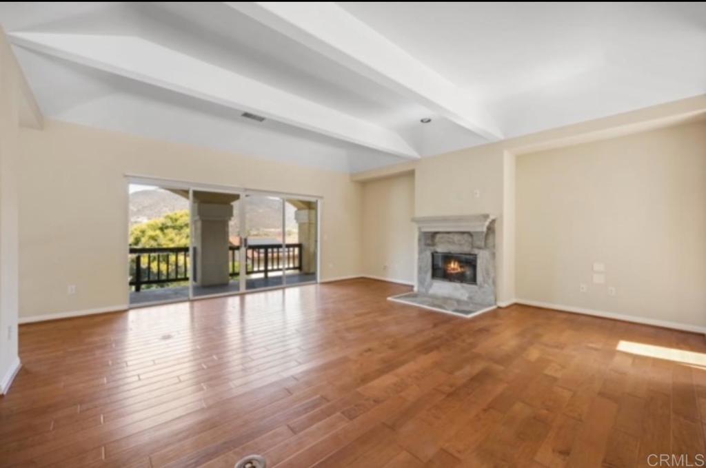 4009 Pala Mesa Oaks Drive Fallbrook, CA 92028 - Photo 6 of 45 a view of an empty room with window and wooden floor