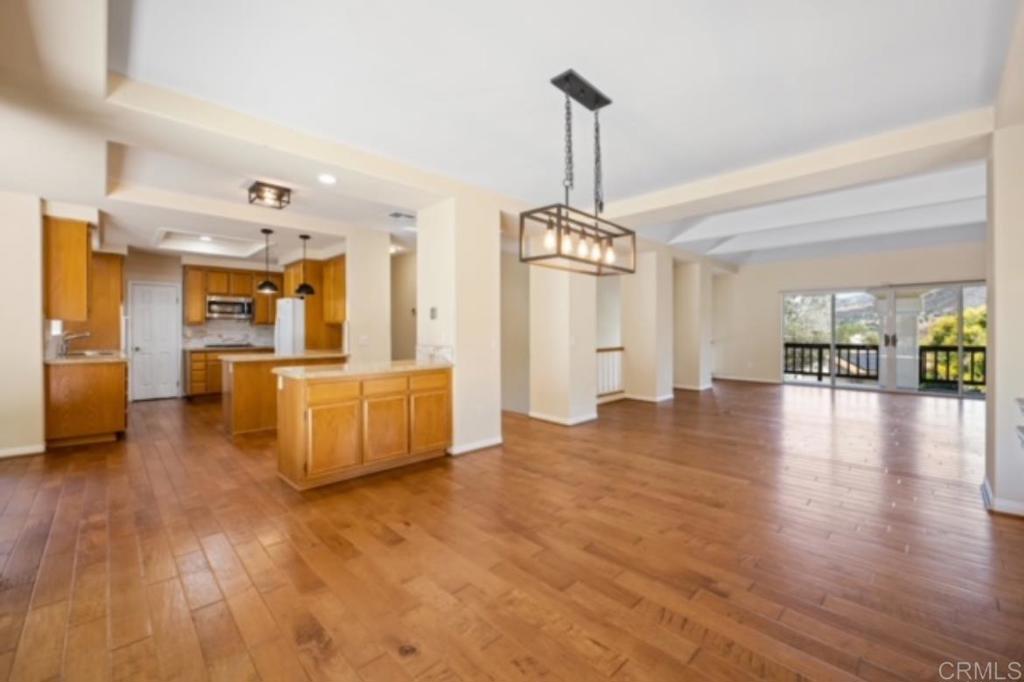 4009 Pala Mesa Oaks Drive Fallbrook, CA 92028 - Photo 10 of 45 a view of a kitchen with furniture and wooden floor