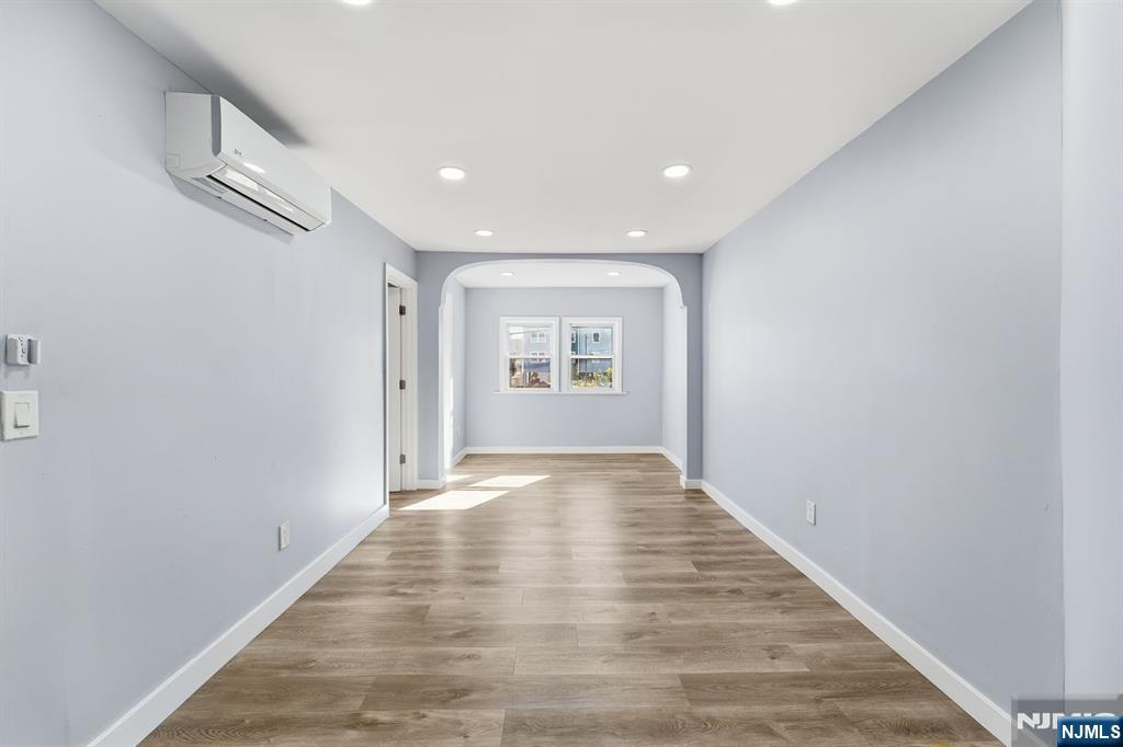 20 Wickham Street Passaic, NJ 07055 - Photo 11 of 20 a view of an empty room and a window