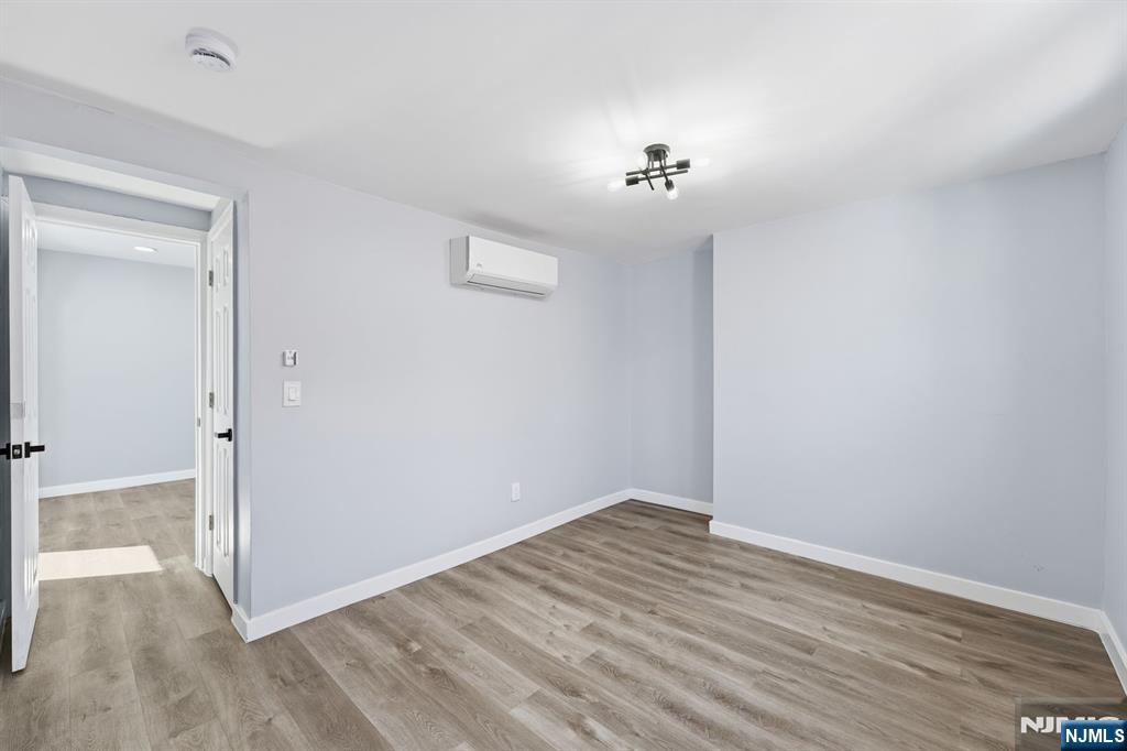 20 Wickham Street Passaic, NJ 07055 - Photo 13 of 20 wooden floor in an empty room