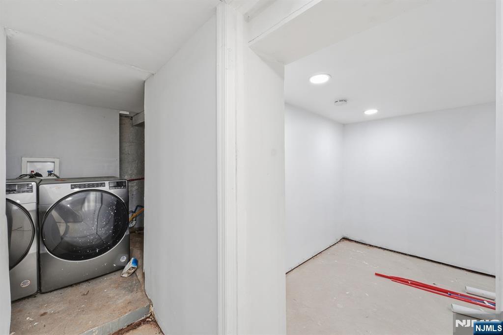 20 Wickham Street Passaic, NJ 07055 - Photo 17 of 20 a utility room with dryer and washer