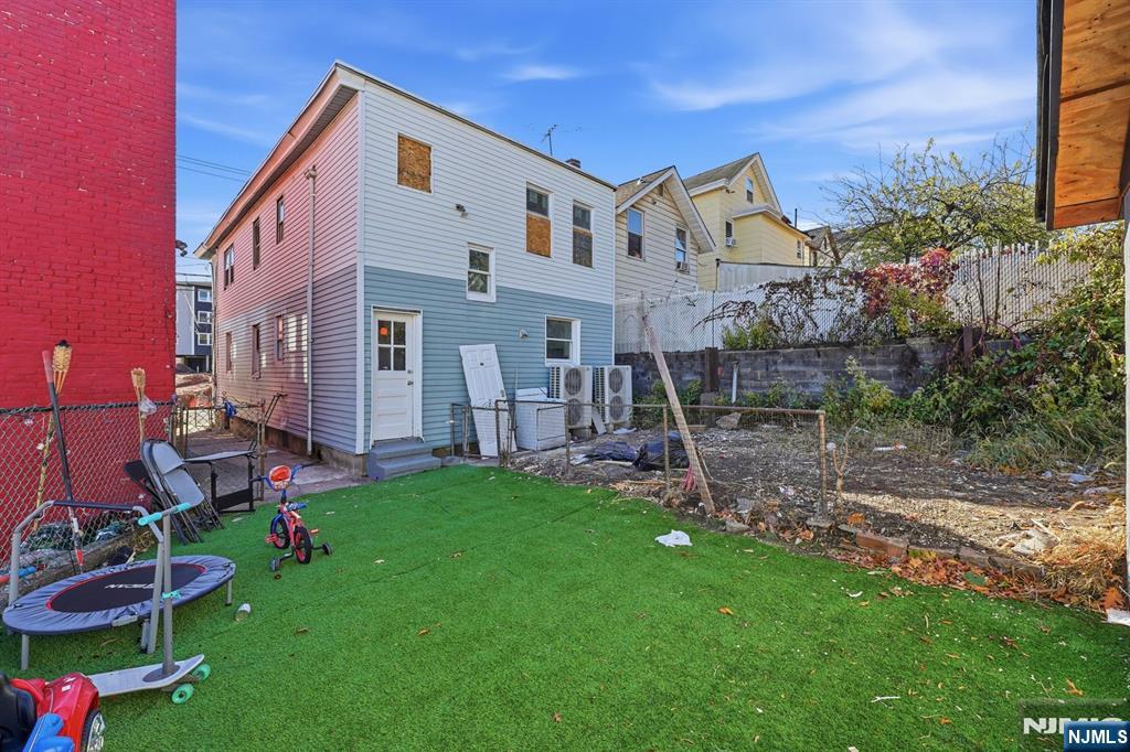 20 Wickham Street Passaic, NJ 07055 - Photo 18 of 20 a view of a house with a yard and sitting area