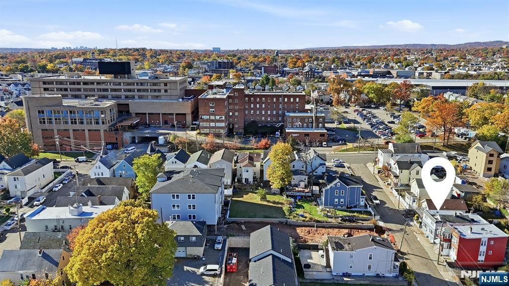 20 Wickham Street Passaic, NJ 07055 - Photo 20 of 20 an aerial view of a houses with yard