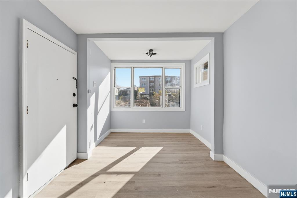 20 Wickham Street Passaic, NJ 07055 - Photo 2 of 20 a view of an entryway with wooden floor