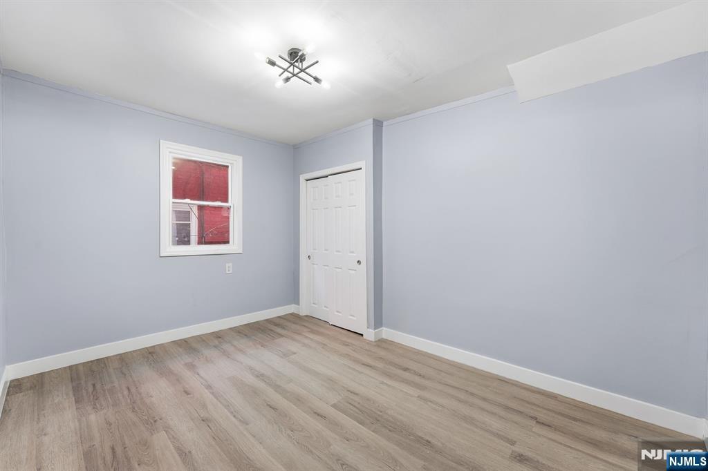 20 Wickham Street Passaic, NJ 07055 - Photo 7 of 20 a view of an empty room with a window