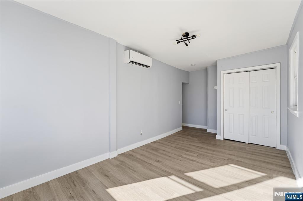 20 Wickham Street Passaic, NJ 07055 - Photo 8 of 20 wooden floor in an empty room