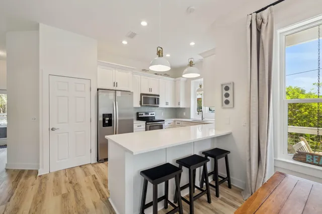 a bathroom with a double vanity sink mirror and shower