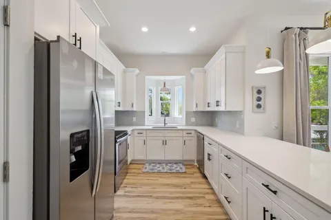 a view of a balcony with wooden floor