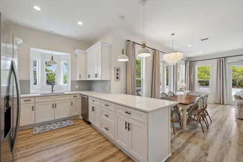 a view of a house with wooden door and deck