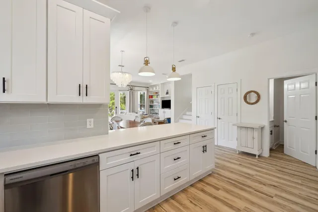 a view of a house with swimming pool and sitting area