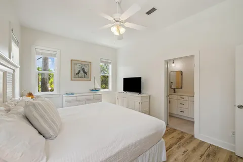 a bedroom with a bed and a view of en suite bathroom