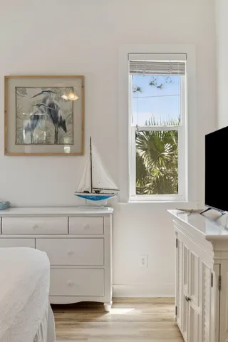 a bed room with a bed and a window