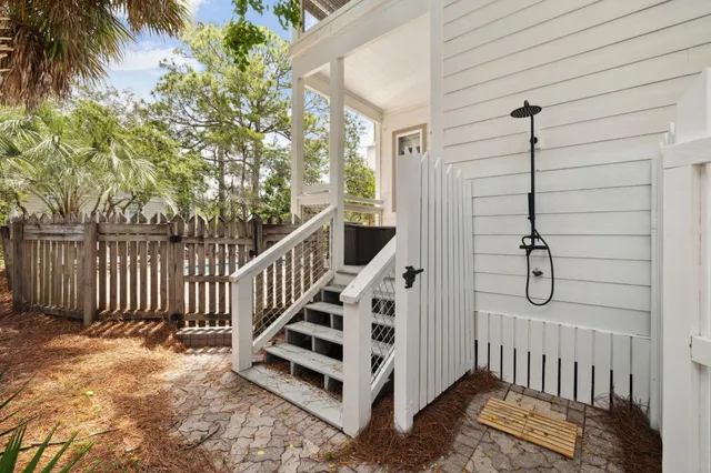 a spacious bedroom with a bed and a tv on table