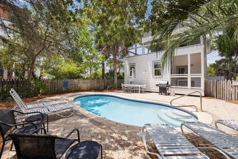 a bathroom with a granite countertop sink mirror and a shower