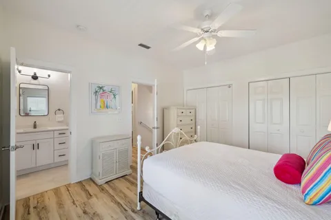 a bedroom with a large bed and a large window