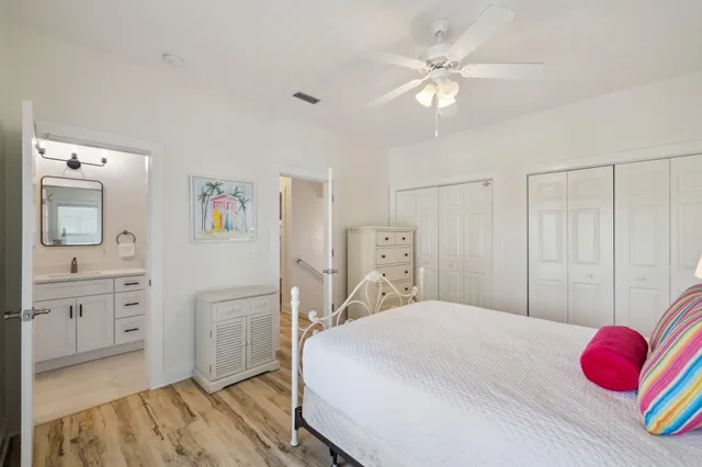 a bedroom with a large bed and a large window