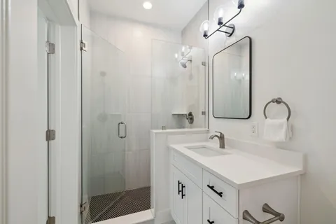 a bathroom with a sink and a mirror