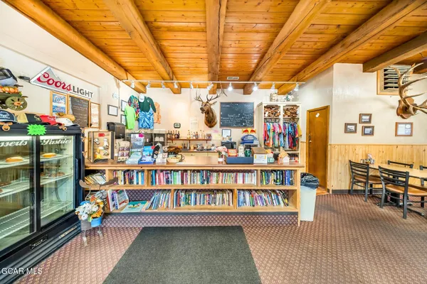 a dining room with furniture water view and a fireplace