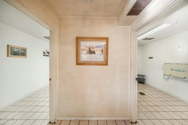 a view of a house with wooden fence