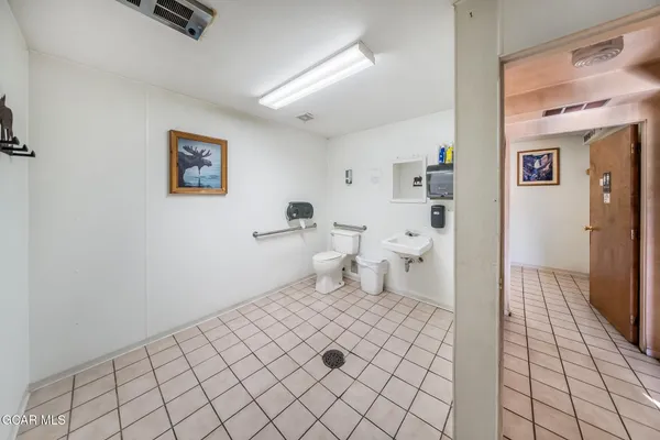 a front view of a house with sitting area