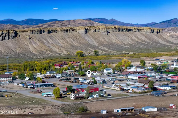 a view of a living room and wooden floor