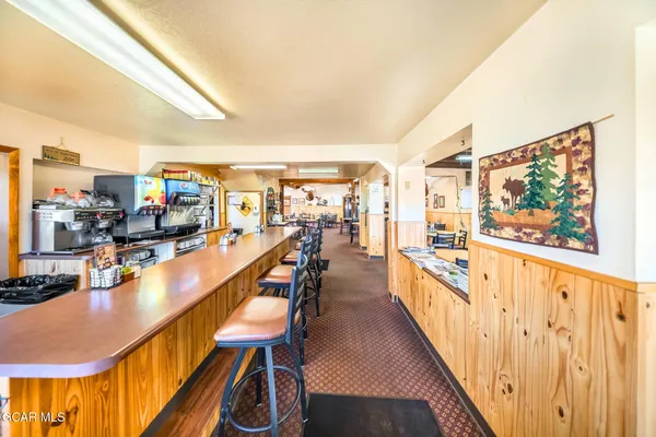 a view of a living room and entry way