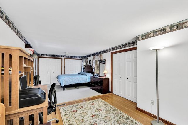 a bedroom with furniture and a window