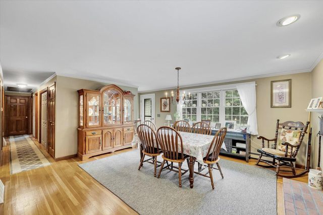 a view of a livingroom with furniture and a window