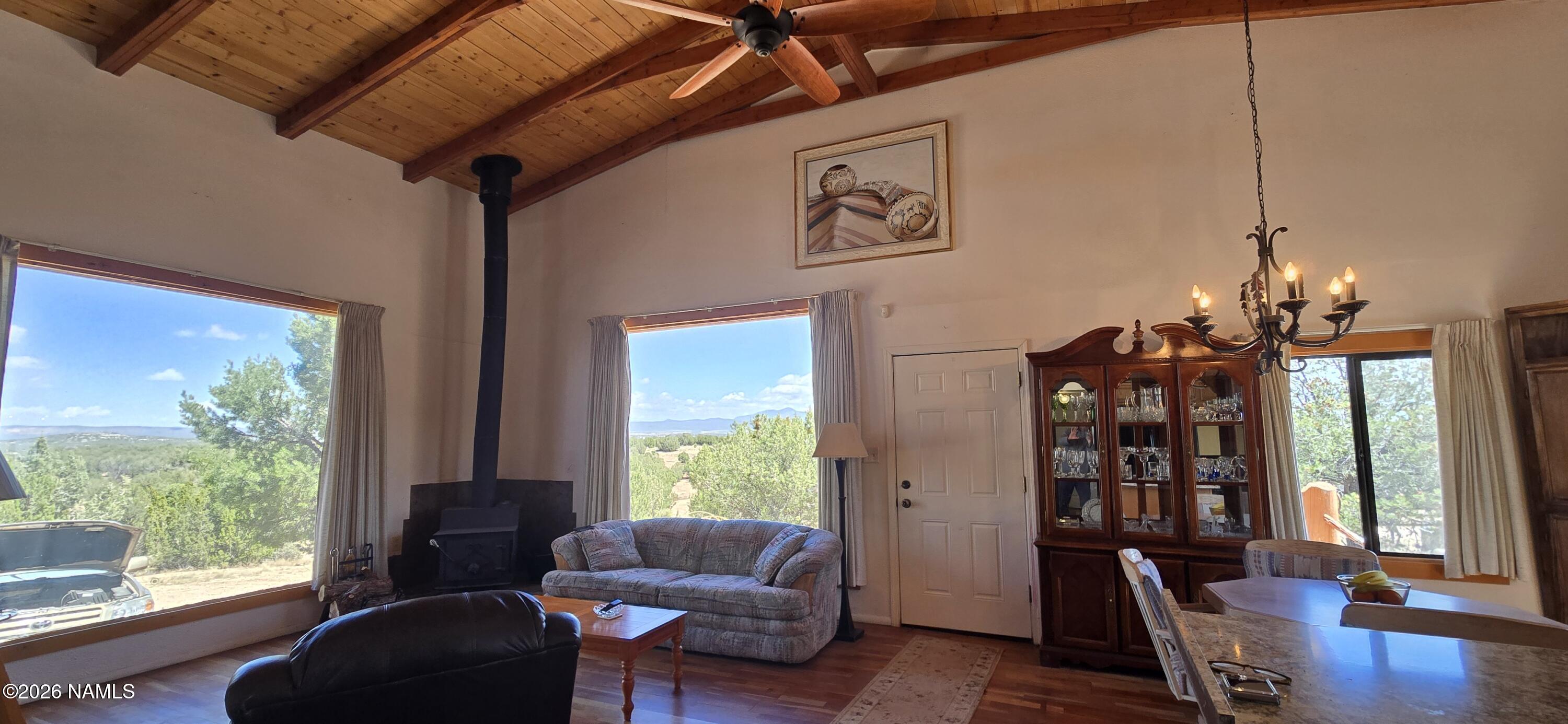 2795 Poppy Road Ash Fork, AZ 86320 - Photo 12 of 56 a living room with furniture and wooden floor
