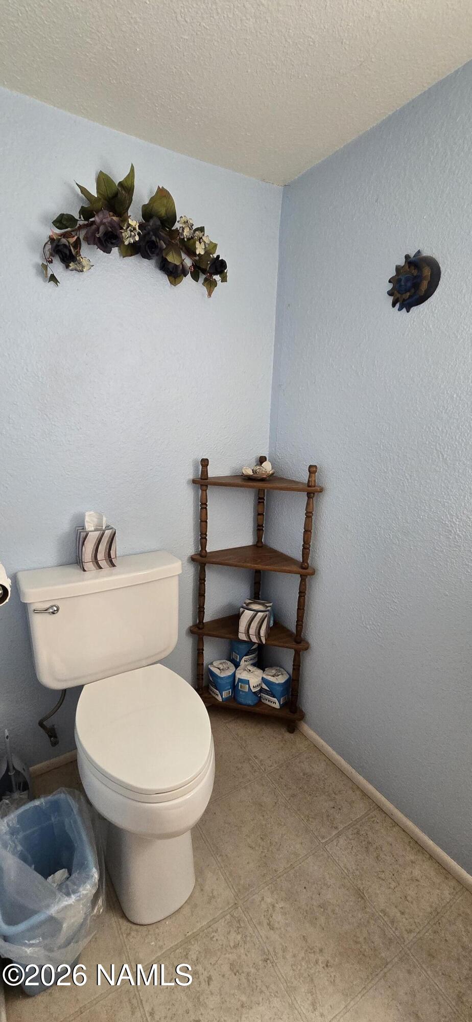 2795 Poppy Road Ash Fork, AZ 86320 - Photo 17 of 56 a bathroom with a toilet and a shower