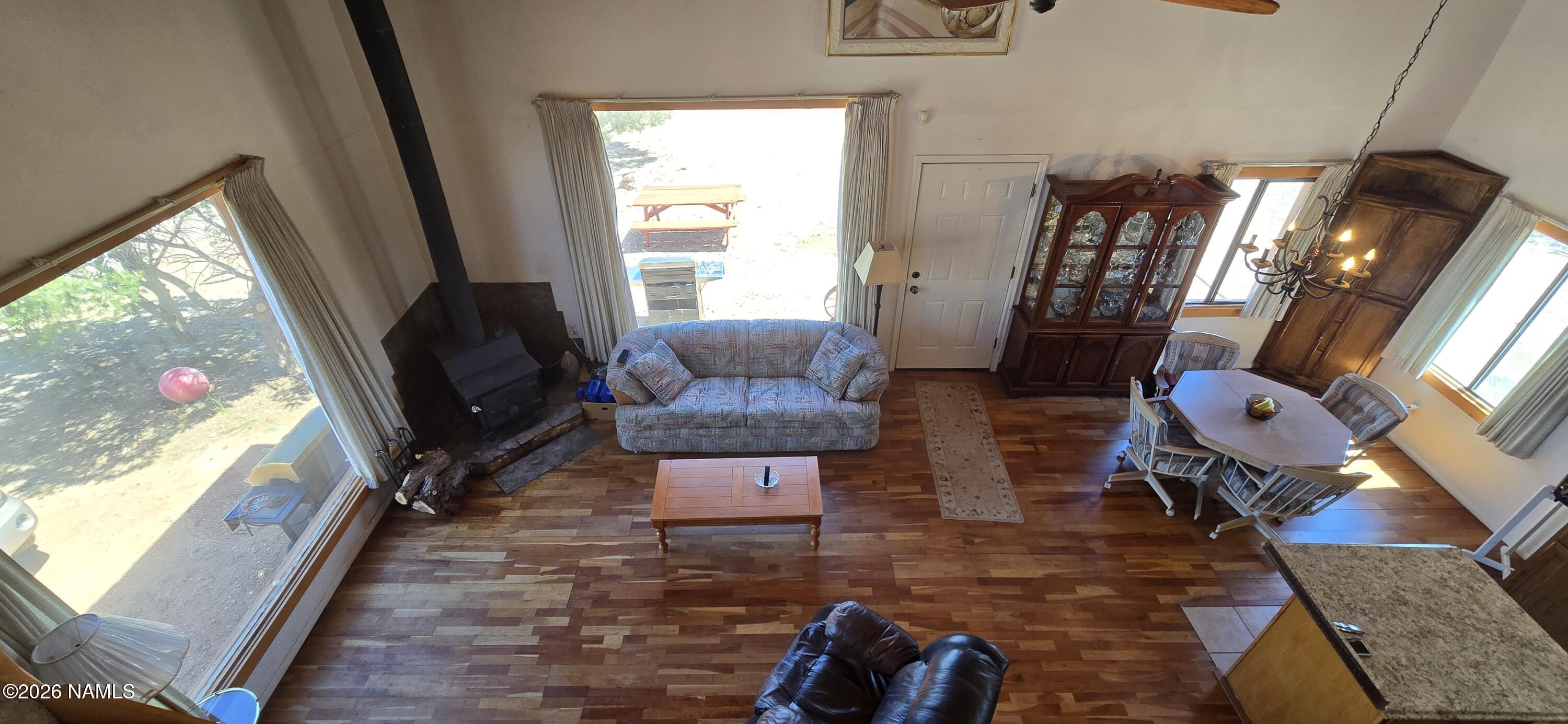 2795 Poppy Road Ash Fork, AZ 86320 - Photo 29 of 56 a living room with furniture rug and wooden floor