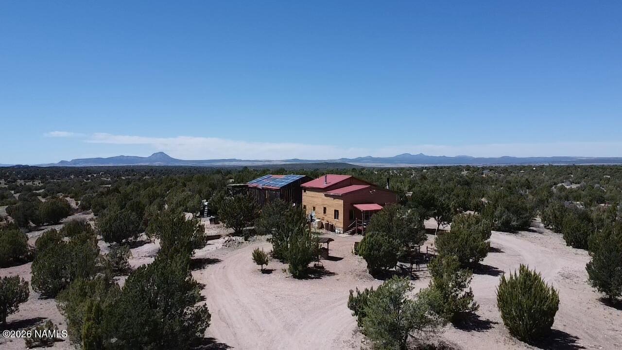 2795 Poppy Road Ash Fork, AZ 86320 - Photo 49 of 56 an outdoor view of house with green space