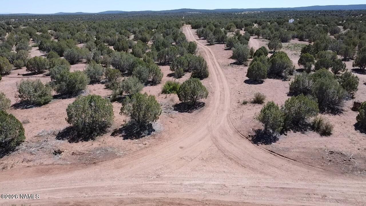 2795 Poppy Road Ash Fork, AZ 86320 - Photo 52 of 56 an aerial view of residential houses with outdoor space